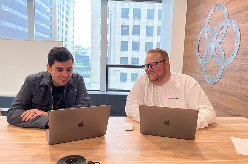 Noah and Nick working in the office