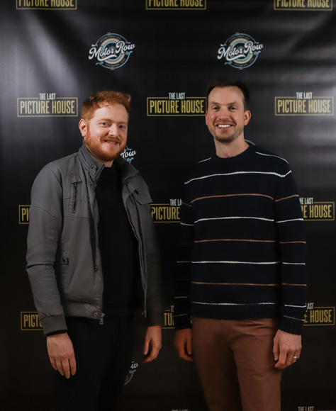 Bryan Woods and Scott Beck stand in front of a Last Picture House banner